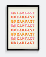A framed art print with the word 'BREAKFAST' repeated in a gradient color pattern from orange to yellow on a white background.